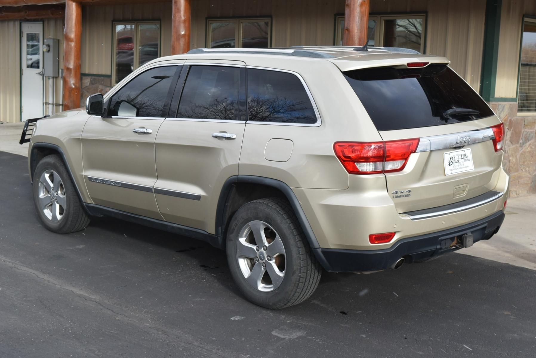 2011 Gold /Tan Jeep Grand Cherokee Limited (1J4RR5GT9BC) with an 5.7L HEMI V-8 engine, 5-Speed Automatic transmission, located at 1600 E Hwy 44, Rapid City, SD, 57703, (605) 716-7878, 44.070232, -103.171410 - Photo #5